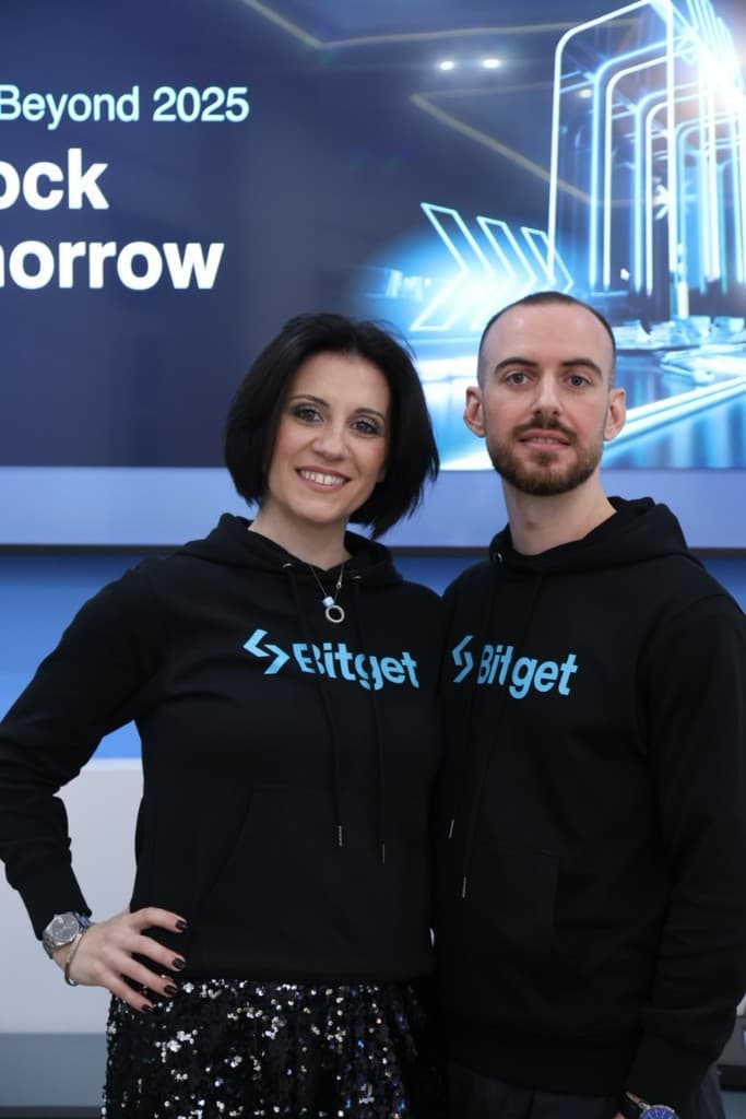 Two people in Bitget hoodies at a Beyond 2025 event.